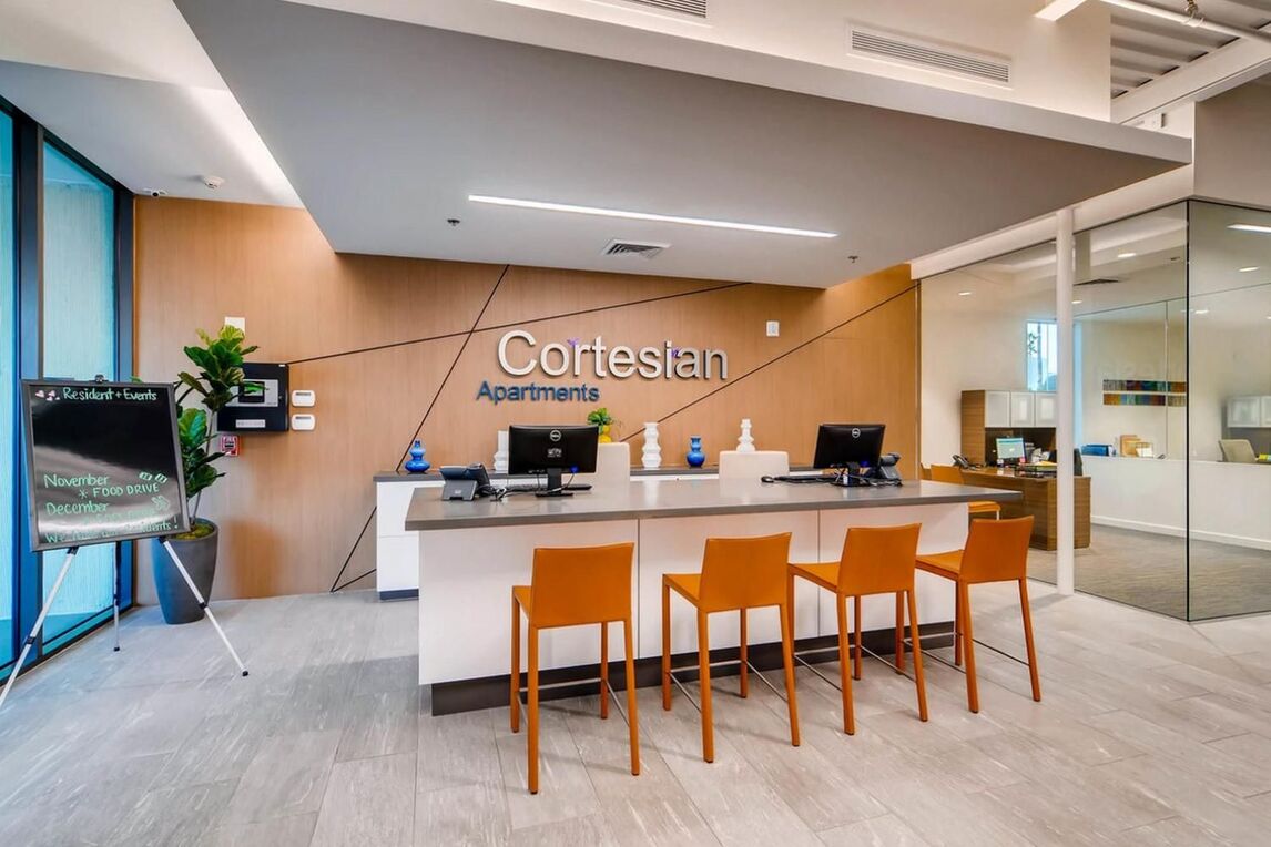 Leasing office reception desk and whiteboard with resident calendar