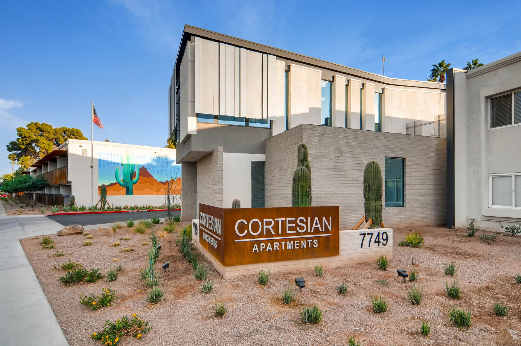 Exterior with view of front sign Cortesian Apartments